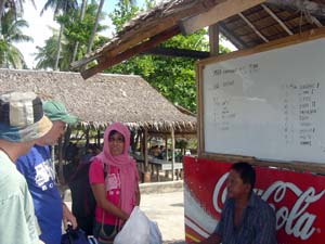 Foreign & local tourists discussing a shared boat ride to Apo Island